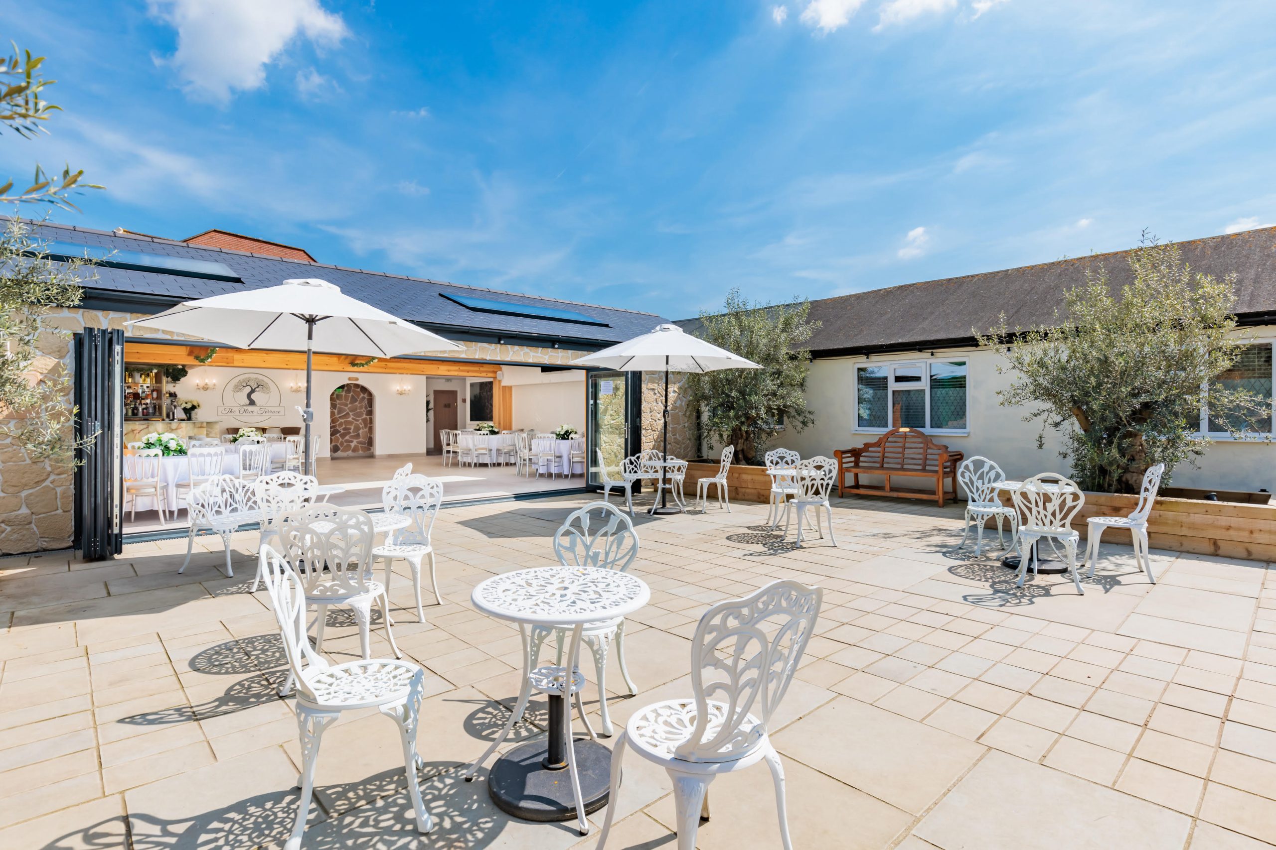 Outdoor patio and garden at The Olive Terrace